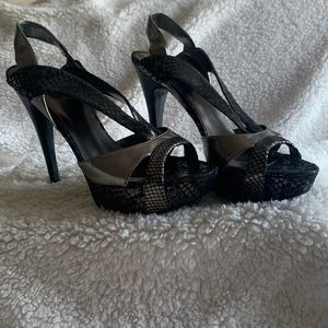Guess / Size 8/ Metallic Silver & Black 5 1/2 in. heel.